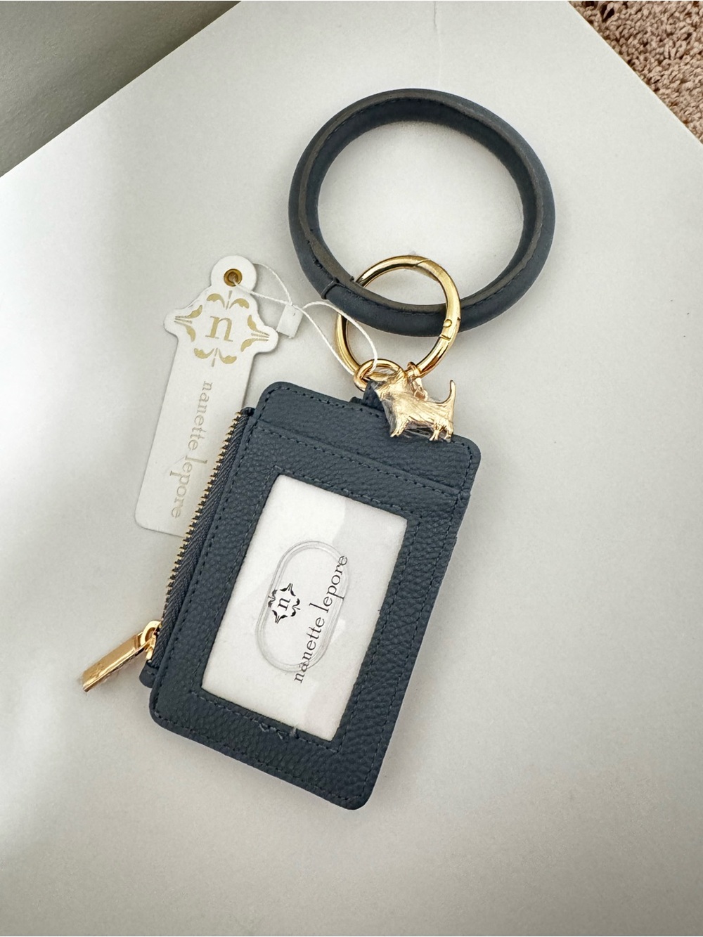 NWT Nanette Lepore dusty blue wristlet with dog charm